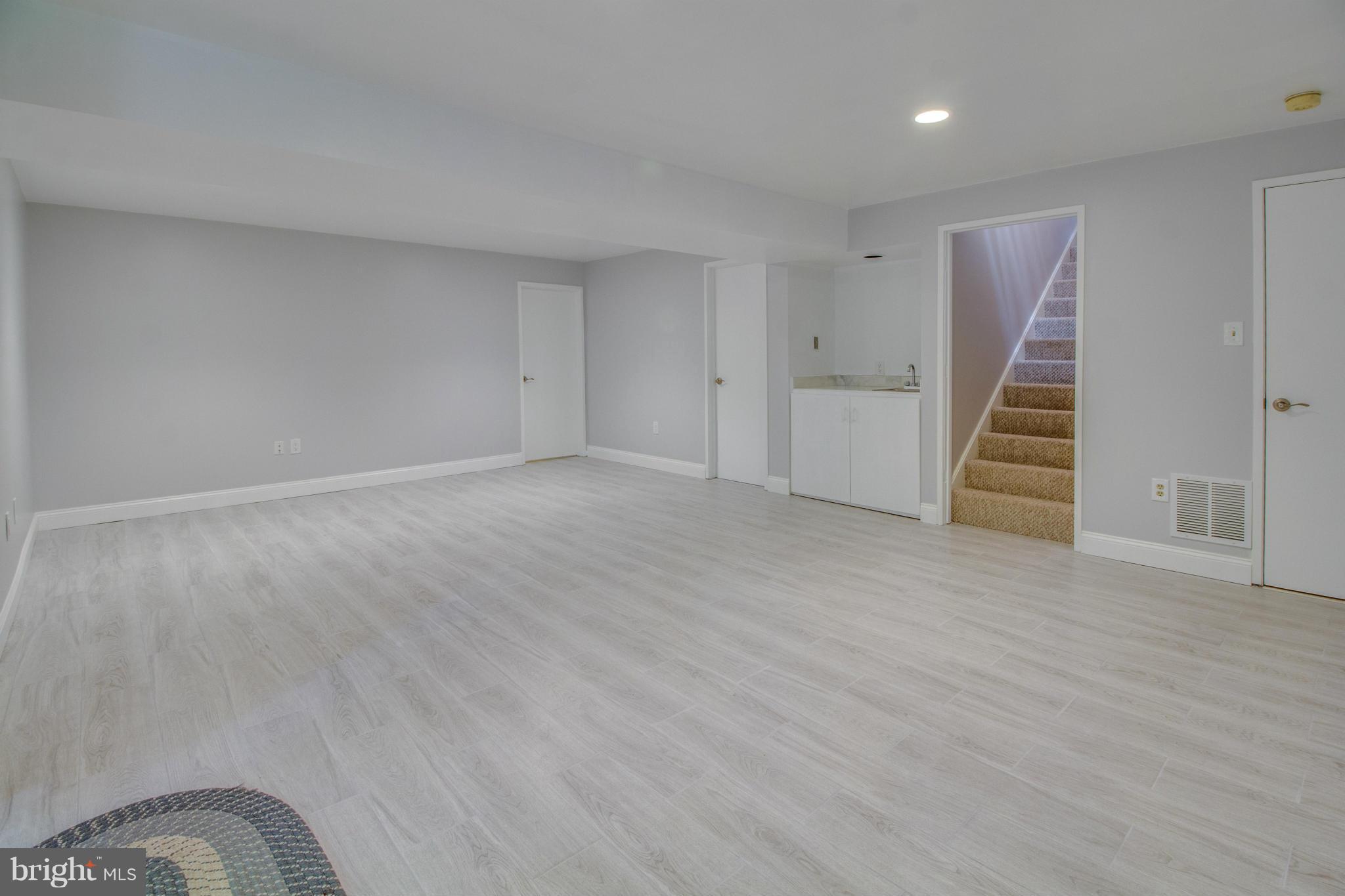 1673 Cedar Hollow Way Reston, VA 20194 - Photo 20 of 30 Rec Room w/ wet bar and walk-out to deck