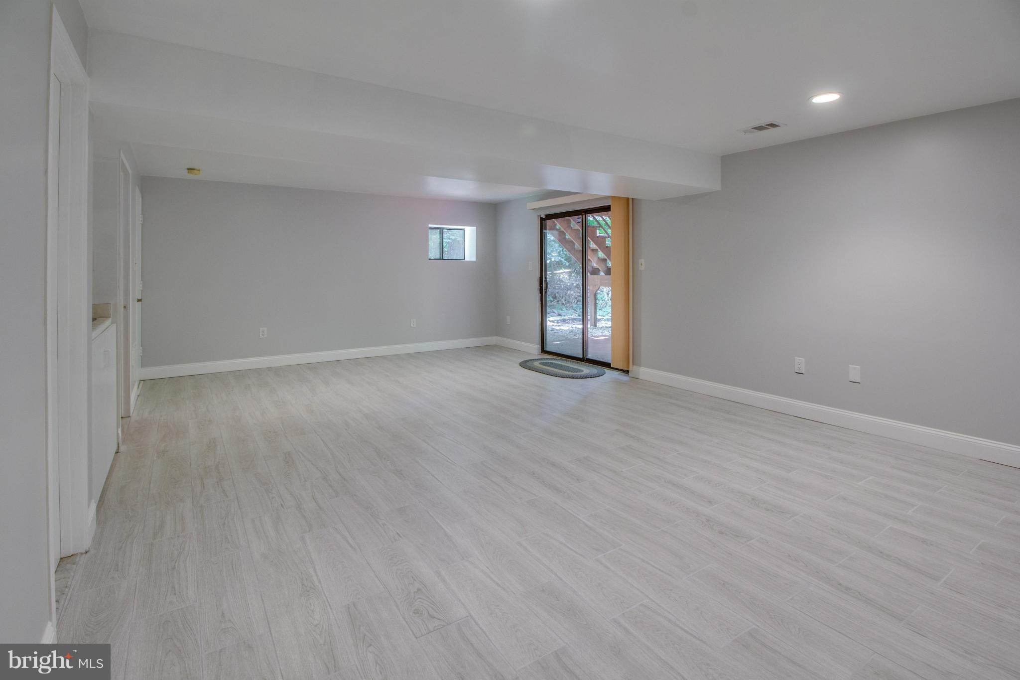1673 Cedar Hollow Way Reston, VA 20194 - Photo 21 of 30 Rec Room w/ wet bar and walk-out to deck