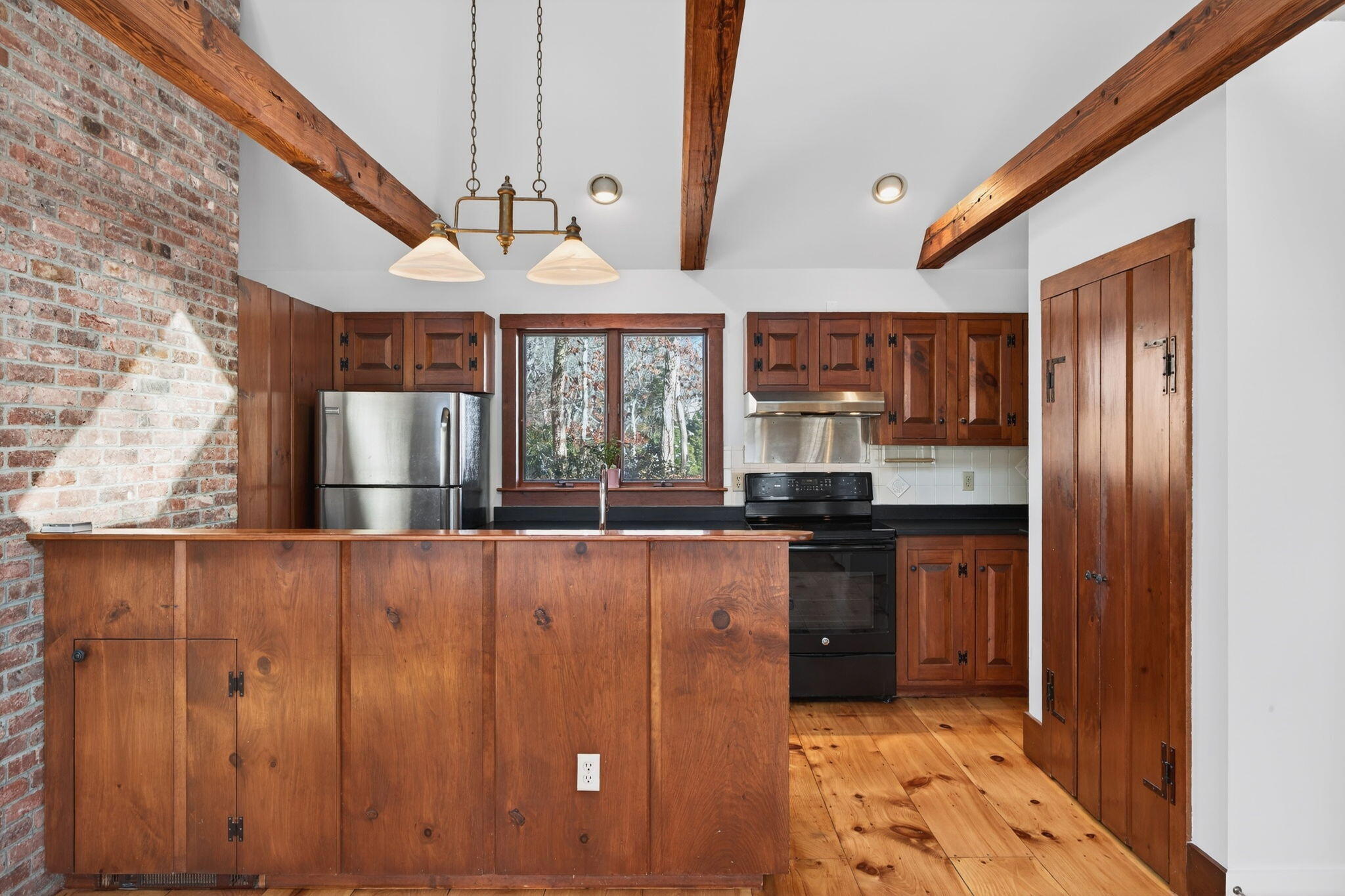 14 Bambi Way Orleans, MA 02653 - Photo 11 of 59 a kitchen with stainless steel appliances granite countertop a refrigerator and a sink