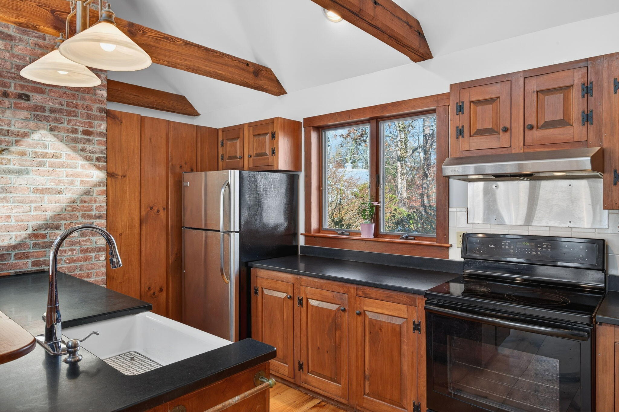 14 Bambi Way Orleans, MA 02653 - Photo 13 of 59 a kitchen with stainless steel appliances a stove a refrigerator and a sink