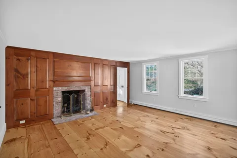 a bathroom with a granite countertop sink vanity mirror and shower