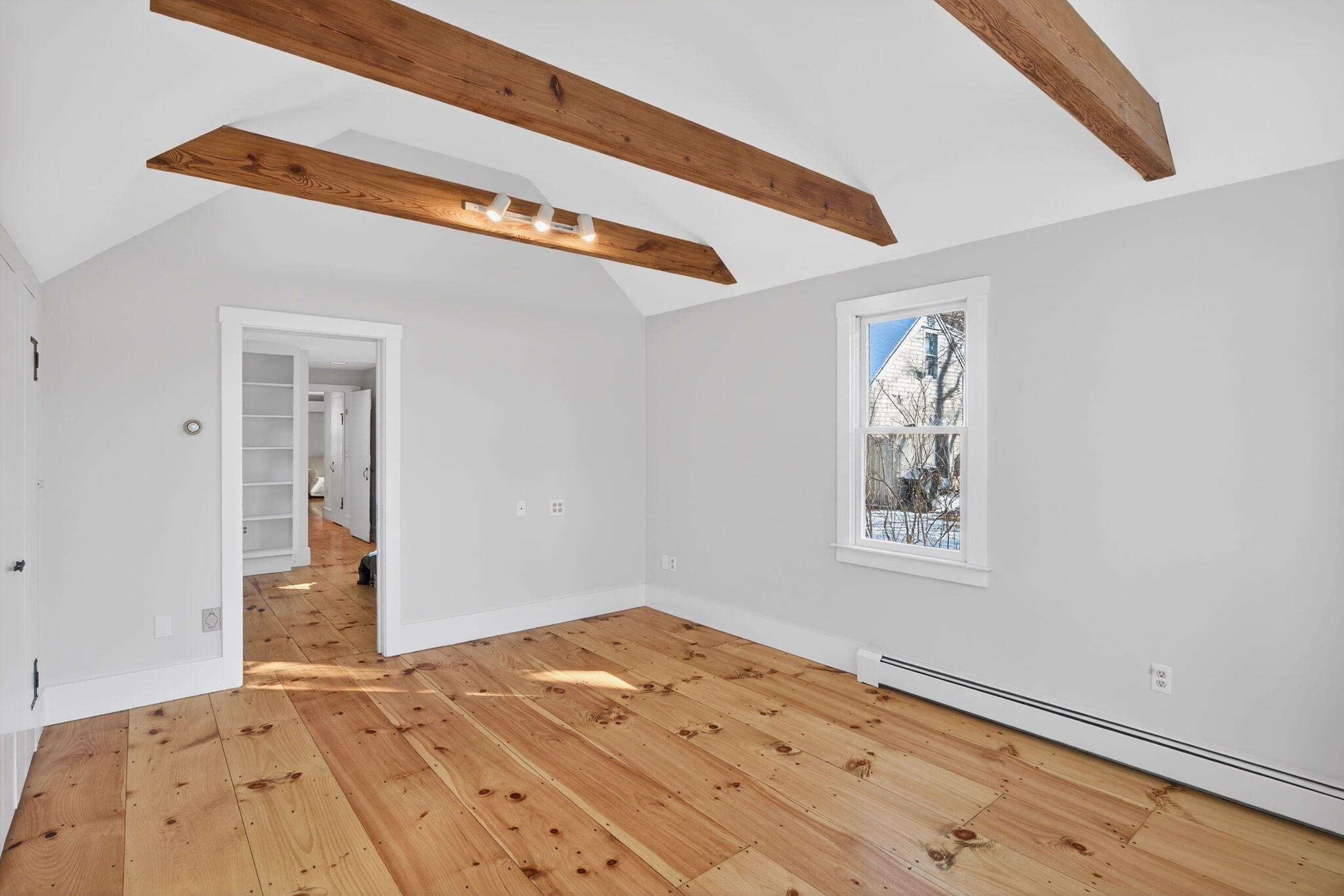 14 Bambi Way Orleans, MA 02653 - Photo 34 of 59 a view of a big room with wooden floor and windows