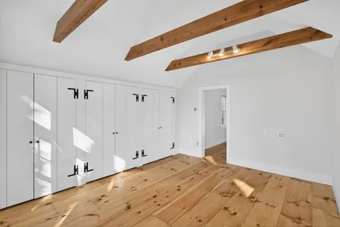 a view of a room with gym equipment and large window