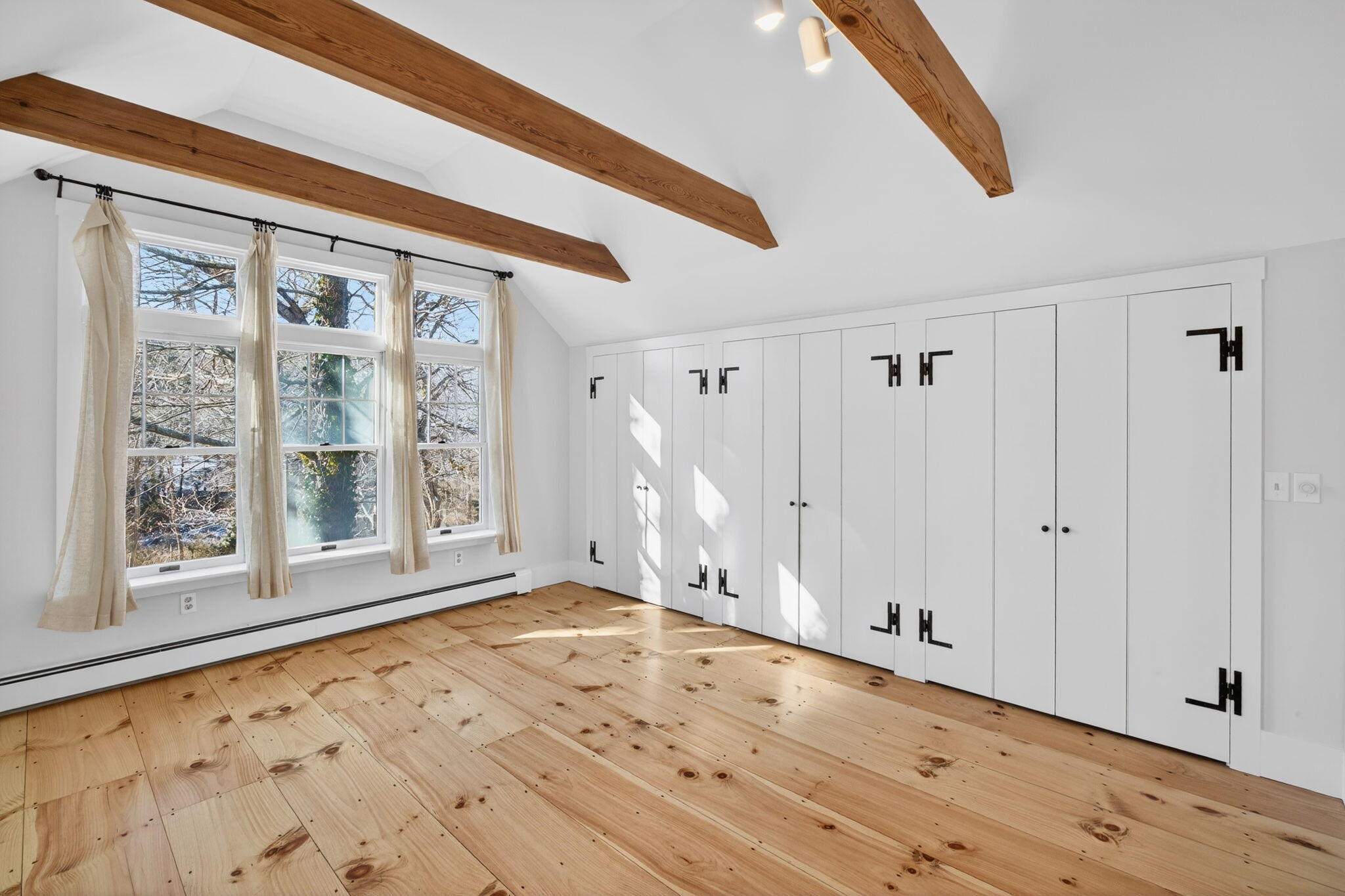 14 Bambi Way Orleans, MA 02653 - Photo 38 of 59 a view of an empty room with window and wooden floor