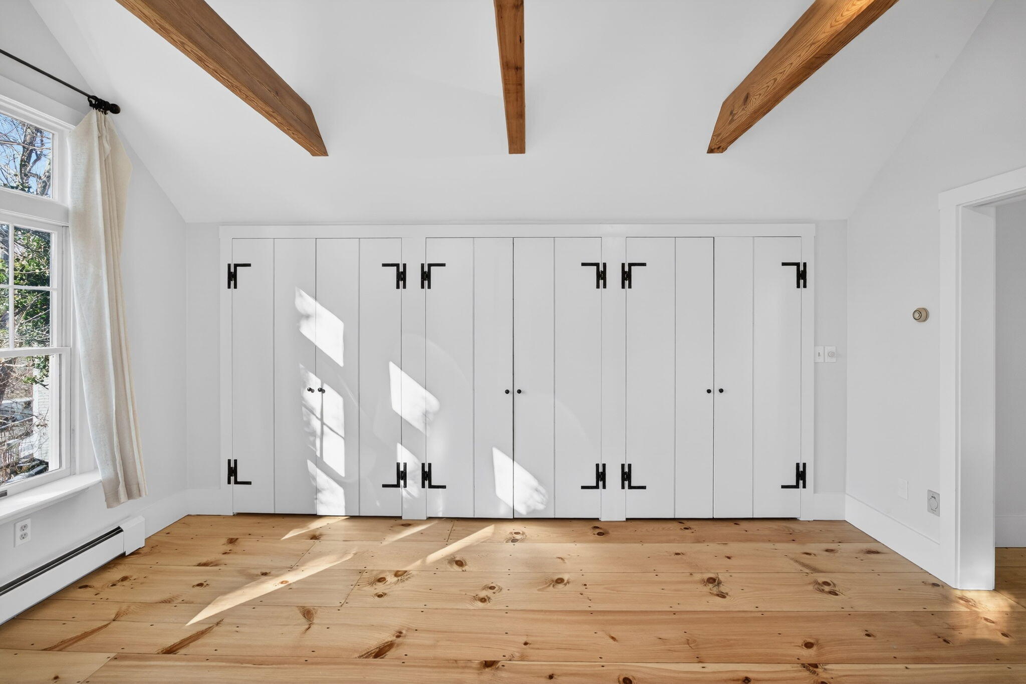 14 Bambi Way Orleans, MA 02653 - Photo 39 of 59 a view of a room with wooden floor and white walls