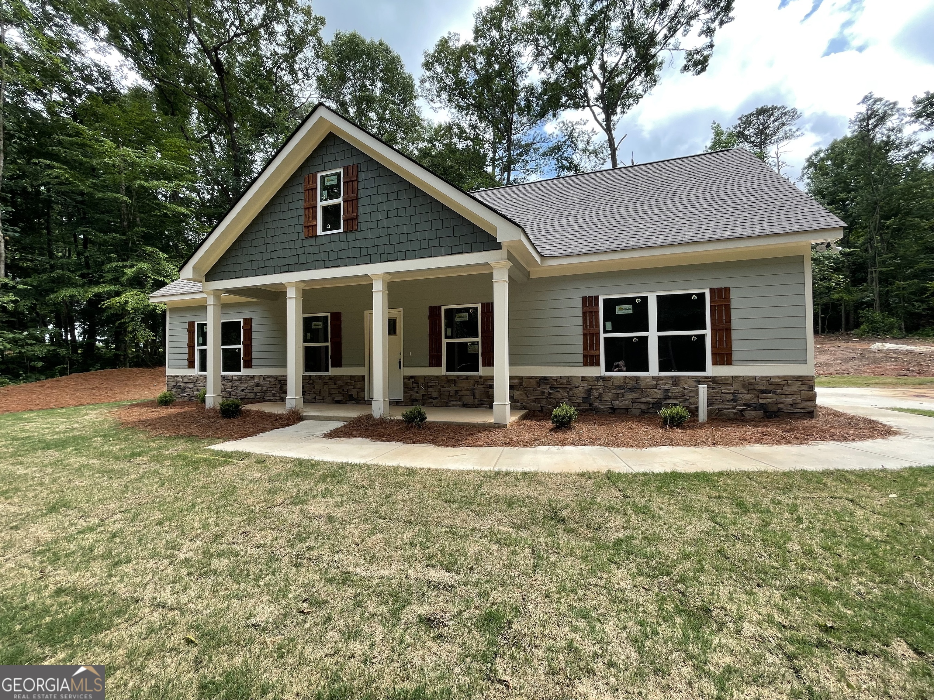 115 Drues Road Bowdon, GA 30108 - Photo 2 of 13 a front view of house with yard and green space
