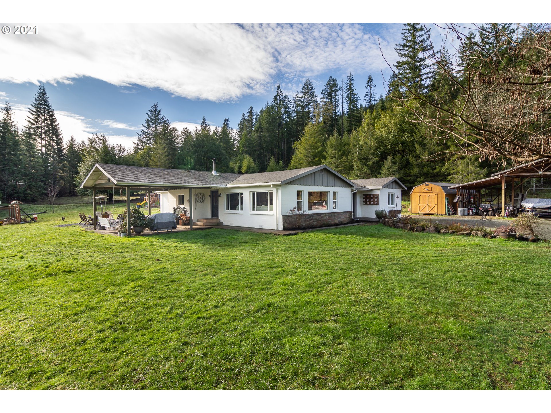 51998 Big Creek Road Myrtle Point, OR 97458 - Photo 1 of 32 a front view of house with yard and seating area