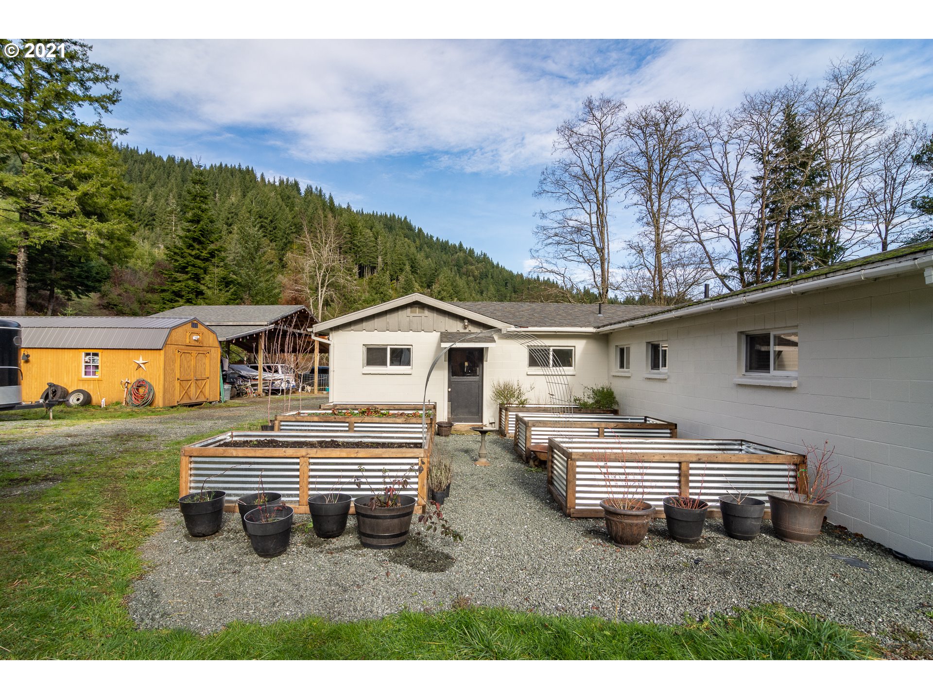 51998 Big Creek Road Myrtle Point, OR 97458 - Photo 28 of 32 a house view with a garden space