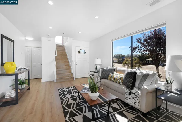 a living room with furniture and a table