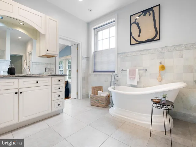a kitchen with cabinets appliances and a window