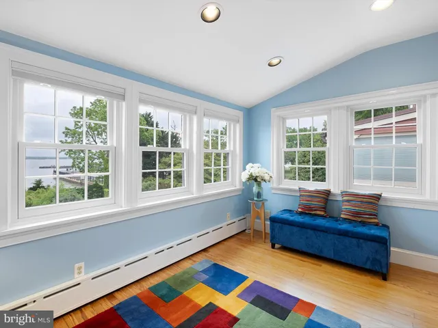 a workspace with wooden floor and a window