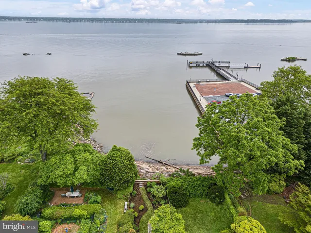 a view of house with a palm tree in the background