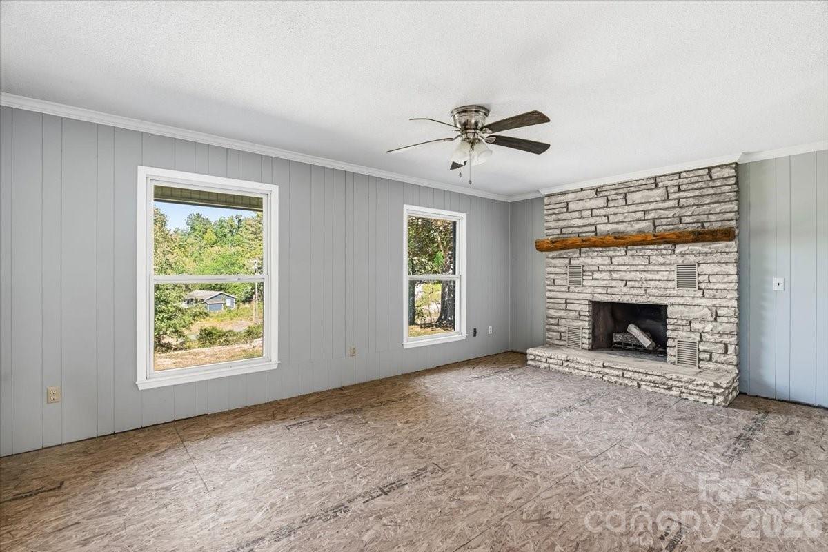 14 Jack Sullins Road Spruce Pine, NC 28777 - Photo 9 of 37 a view of an empty room with window and fireplace