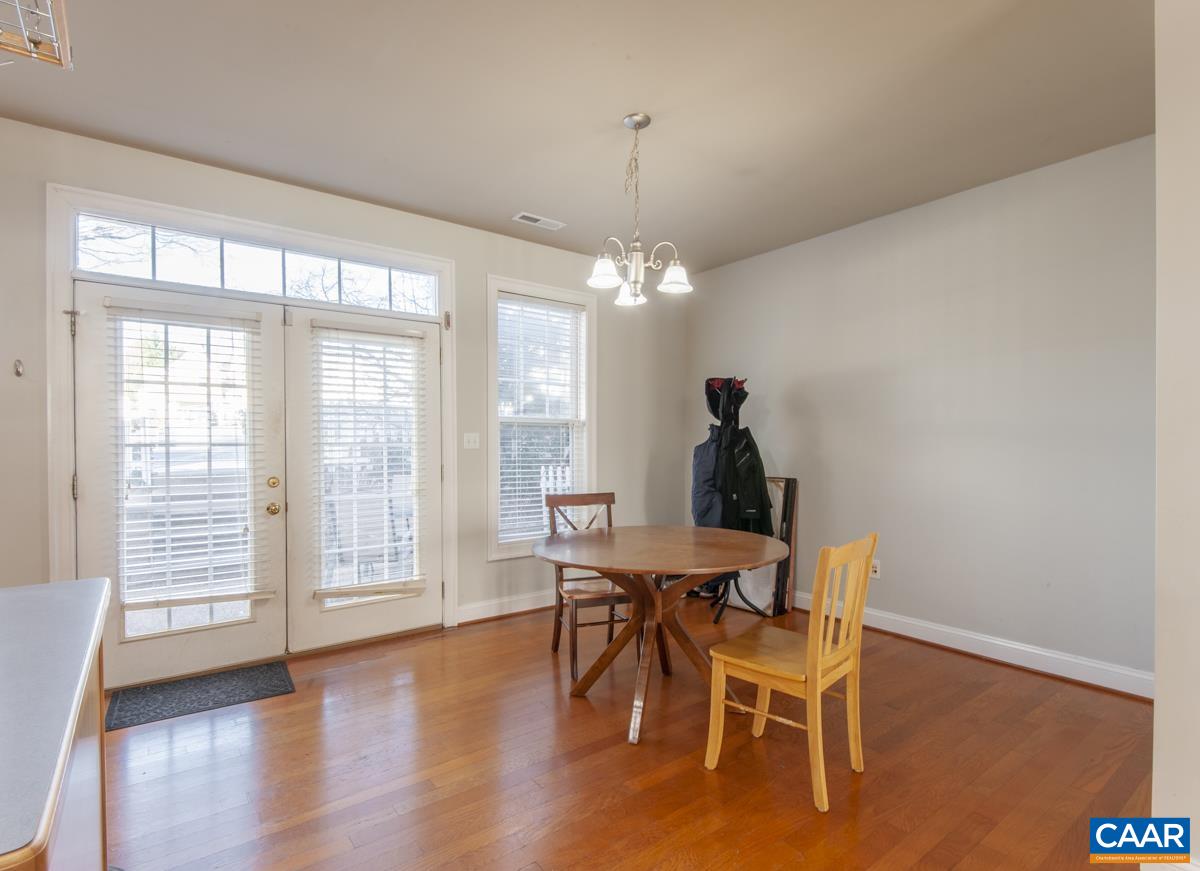 1140 Edmond Court Crozet, VA 22932 - Photo 11 of 34 a dining room with furniture window wooden floor