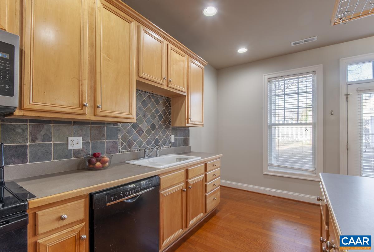 1140 Edmond Court Crozet, VA 22932 - Photo 16 of 34 a kitchen with stainless steel appliances granite countertop a sink stove and cabinets