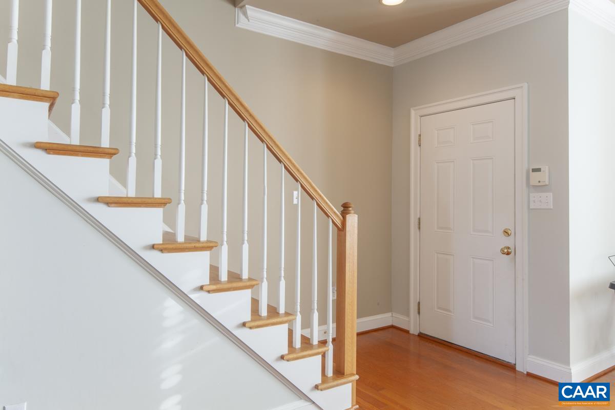 1140 Edmond Court Crozet, VA 22932 - Photo 17 of 34 a view of staircase with railing and white walls