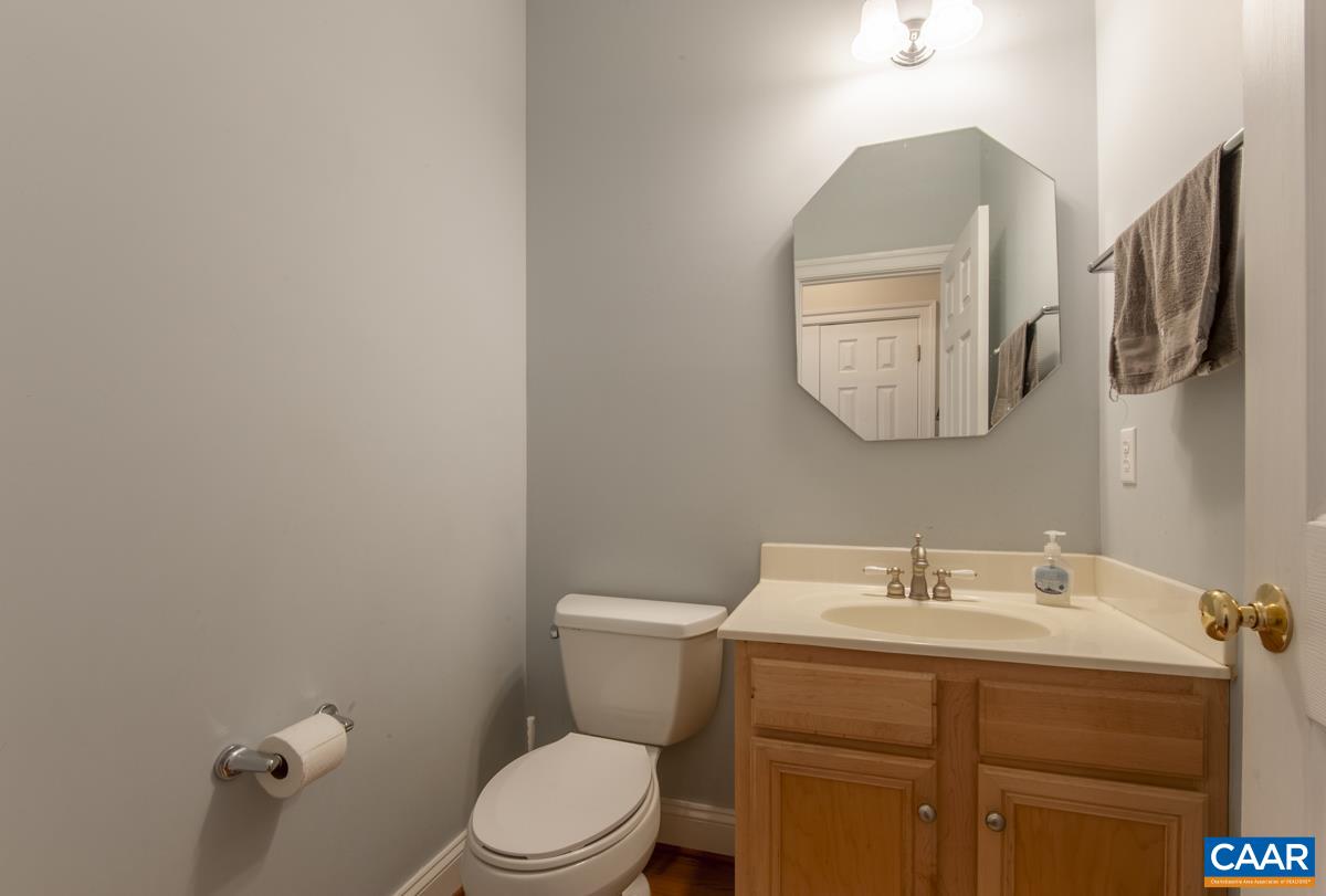1140 Edmond Court Crozet, VA 22932 - Photo 18 of 34 a bathroom with a toilet sink and mirror