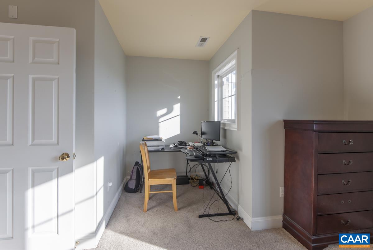 1140 Edmond Court Crozet, VA 22932 - Photo 21 of 34 a workspace with furniture and window in a room