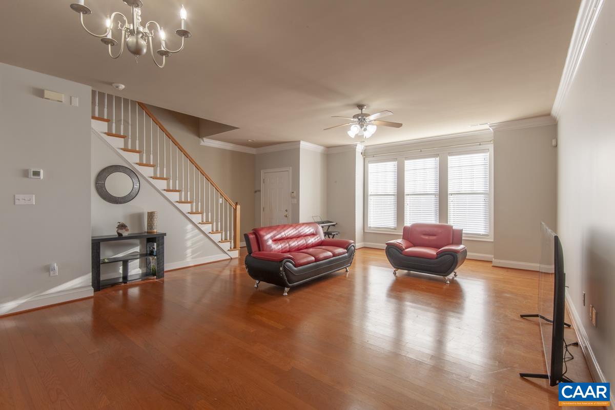 1140 Edmond Court Crozet, VA 22932 - Photo 3 of 34 a living room with furniture and a chandelier