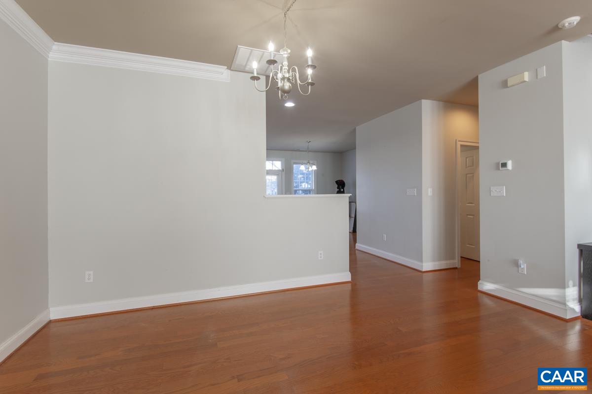 1140 Edmond Court Crozet, VA 22932 - Photo 7 of 34 a view of livingroom with hallway and wooden floor