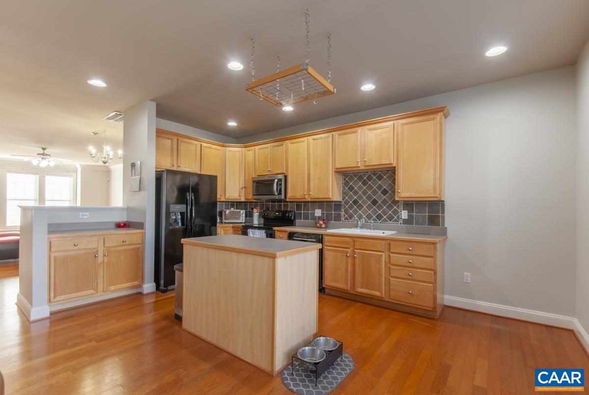 1140 Edmond Court Crozet, VA 22932 - Photo 8 of 34 a kitchen with refrigerator and cabinets