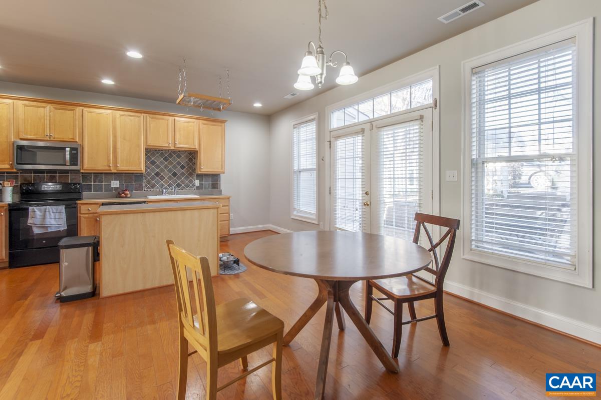 1140 Edmond Court Crozet, VA 22932 - Photo 9 of 34 a view of a dining room with furniture window and wooden floor