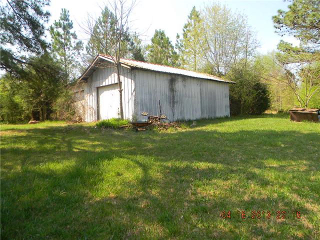 1180 Haskell Akins Road Bethpage, TN 37022 - Photo 5 of 5 a house with green field in front of it