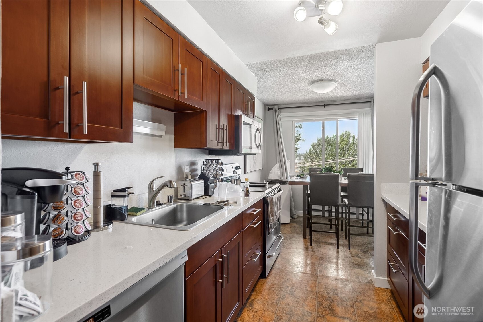 2414 13th Avenue South Seattle, WA 98144 - Photo 6 of 17 a kitchen with sink cabinets and appliances