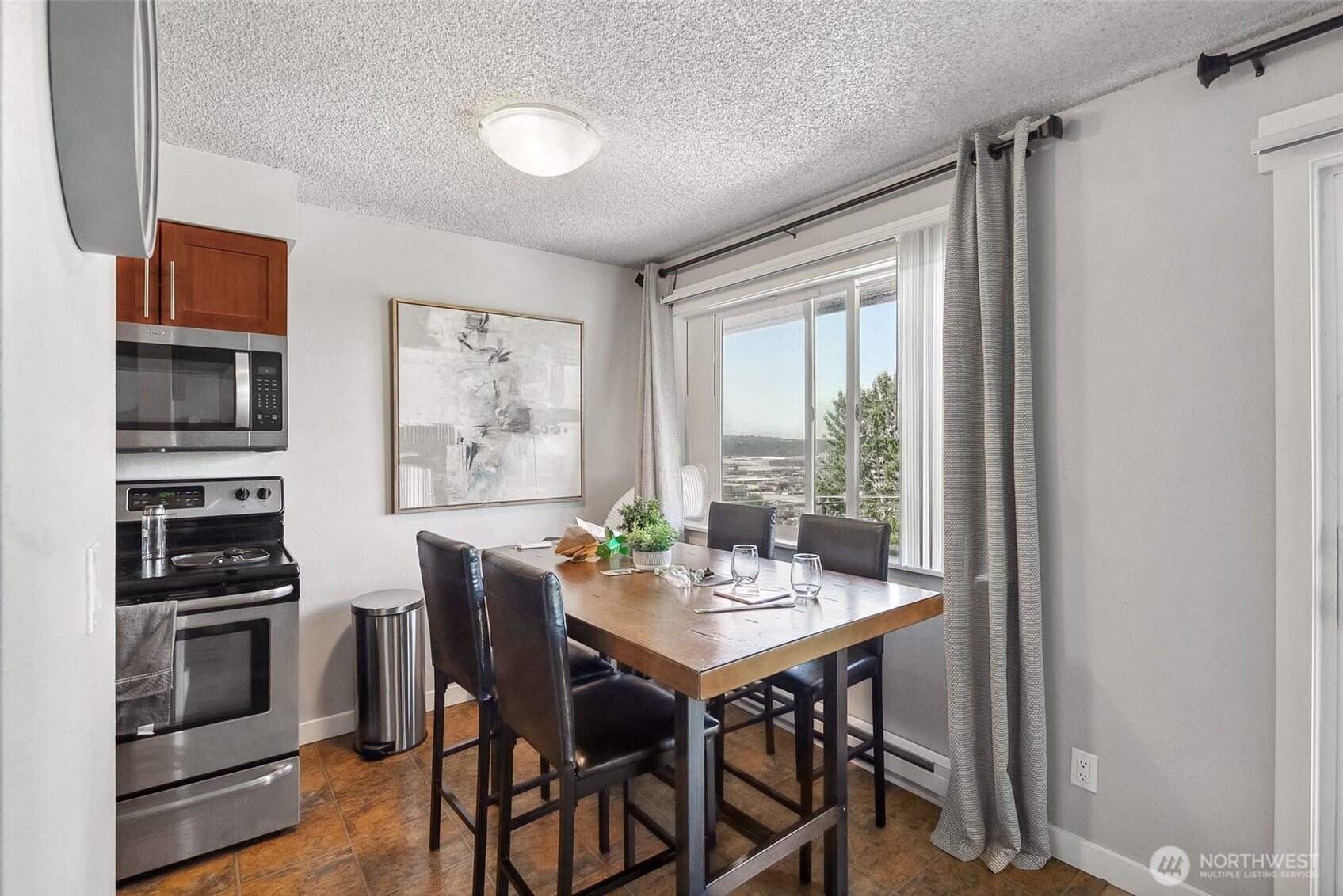 2414 13th Avenue South Seattle, WA 98144 - Photo 9 of 17 a view of a dining room with furniture window and wooden floor