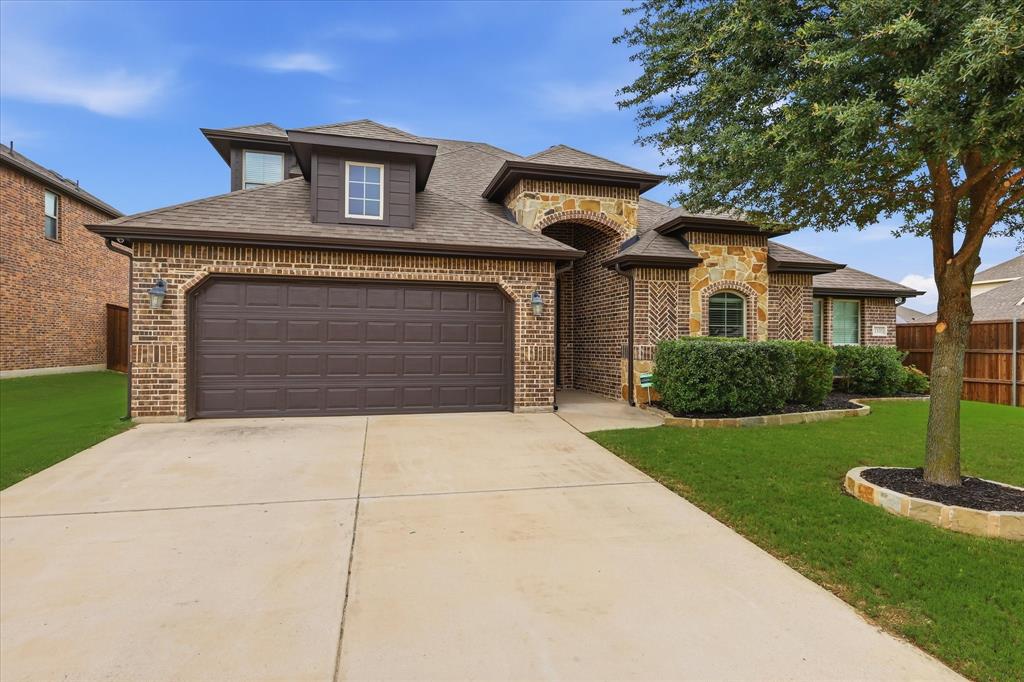 1105 Safrano Street Midlothian, TX 76065 - Photo 2 of 25 a front view of a house with garden