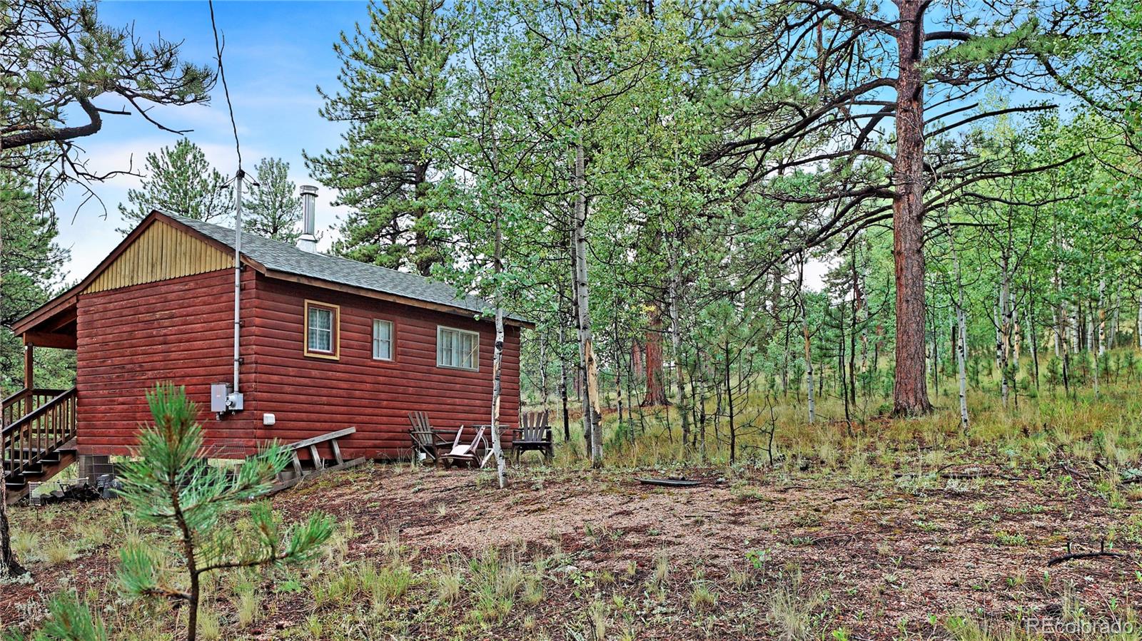 109 Wolf Road Bailey, CO 80421 - Photo 11 of 18 a view of a house with a yard and sitting area