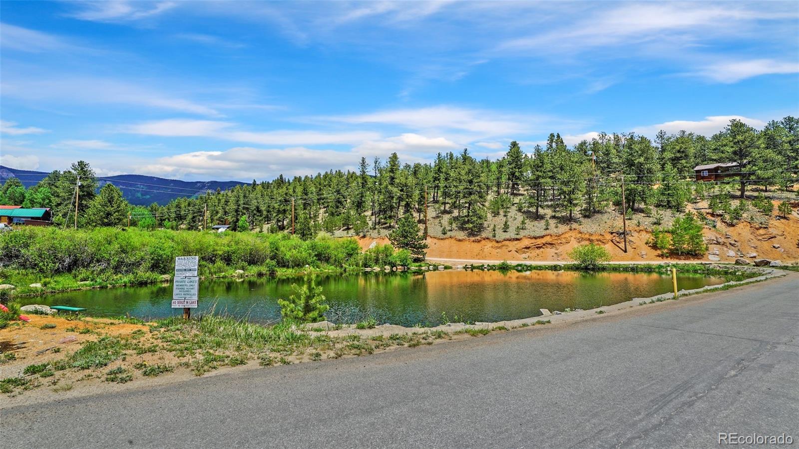 109 Wolf Road Bailey, CO 80421 - Photo 13 of 18 a view of a lake with a big yard