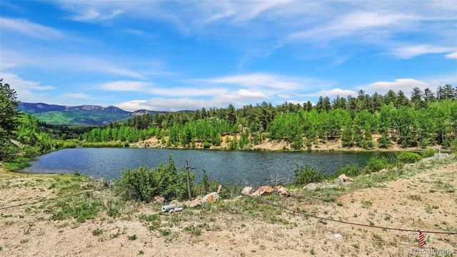 a view of a lake with a mountain in the background