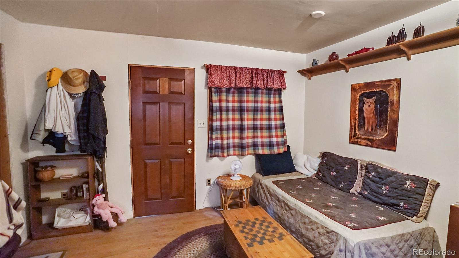 109 Wolf Road Bailey, CO 80421 - Photo 7 of 18 a living room with furniture a window and a closet