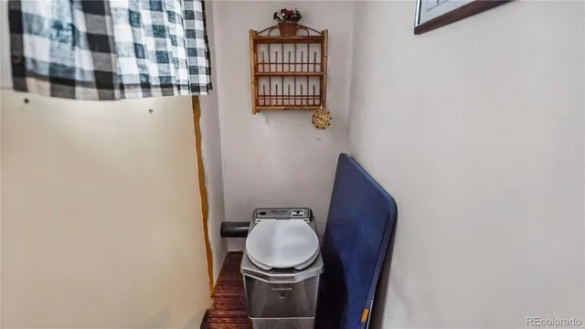a bathroom with a toilet and a sink