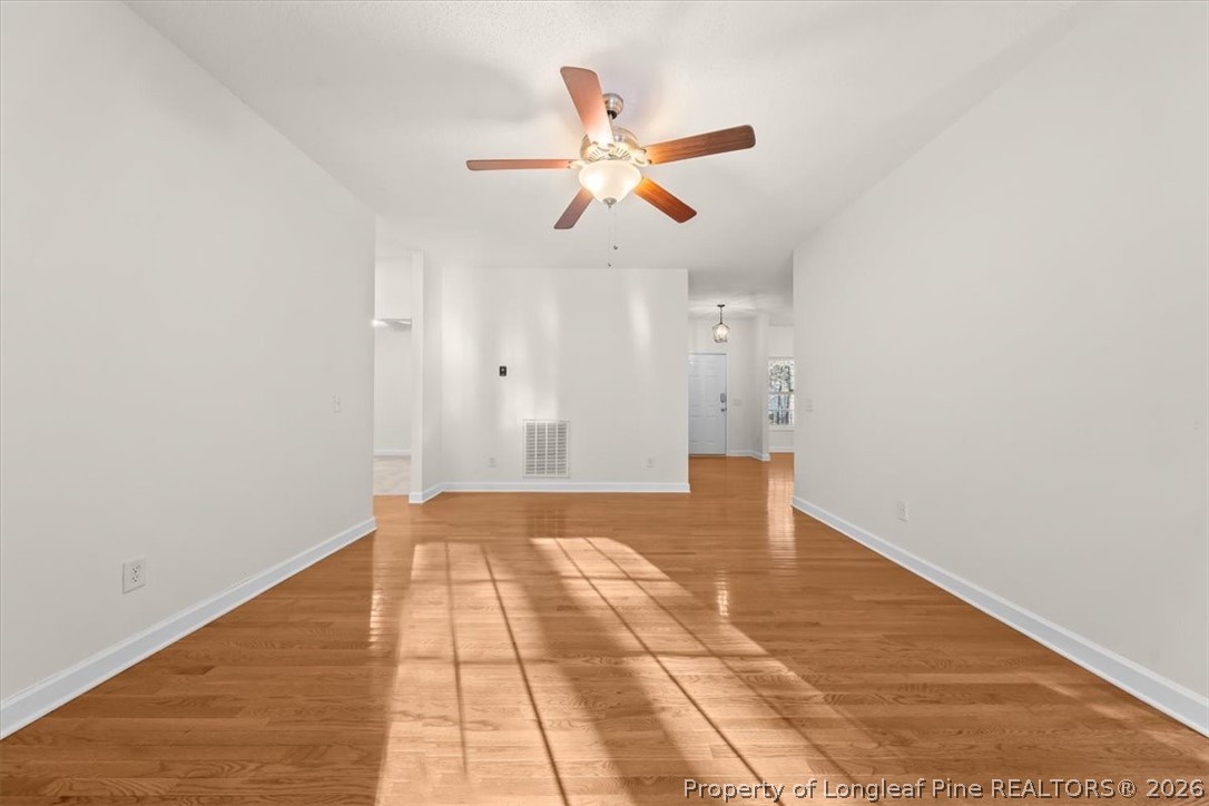60 Spring Lake Drive Pinehurst, NC 28374 - Photo 11 of 42 a view of empty room with wooden floor and fan