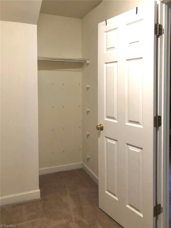 8117 Chestershire Road Oak Ridge, NC 27310 - Photo 24 of 50 The other side of the primary walk-in closet.