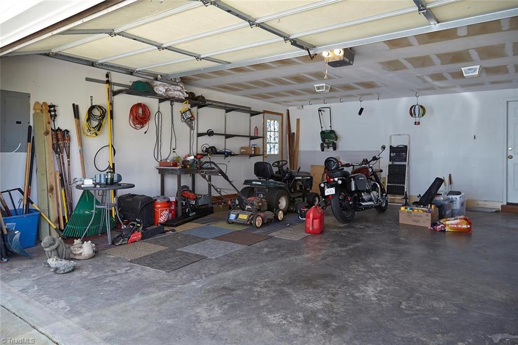 8117 Chestershire Road Oak Ridge, NC 27310 - Photo 38 of 50 2 car side-load garage.