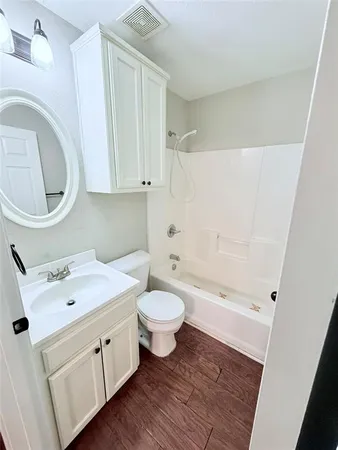 a bathroom with a sink a toilet and a bathtub
