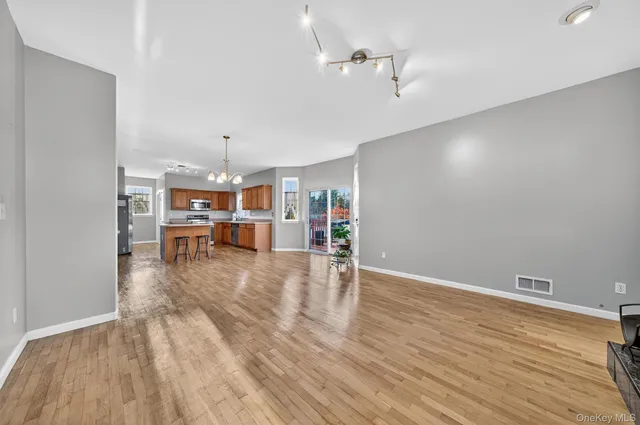 a view of a room with wooden floor