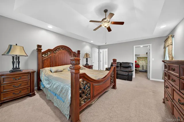 a bed room with a bed and a chandelier