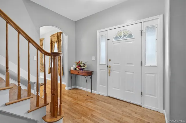 a view of an entryway with wooden floor