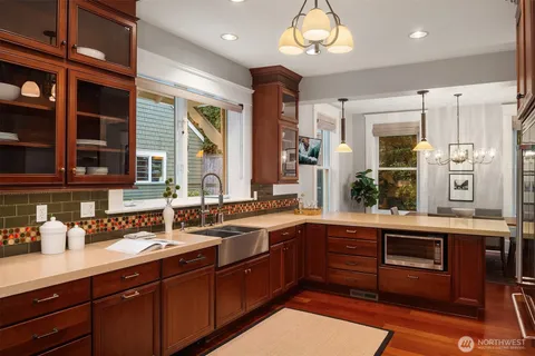 a kitchen with stainless steel appliances granite countertop a stove and a refrigerator