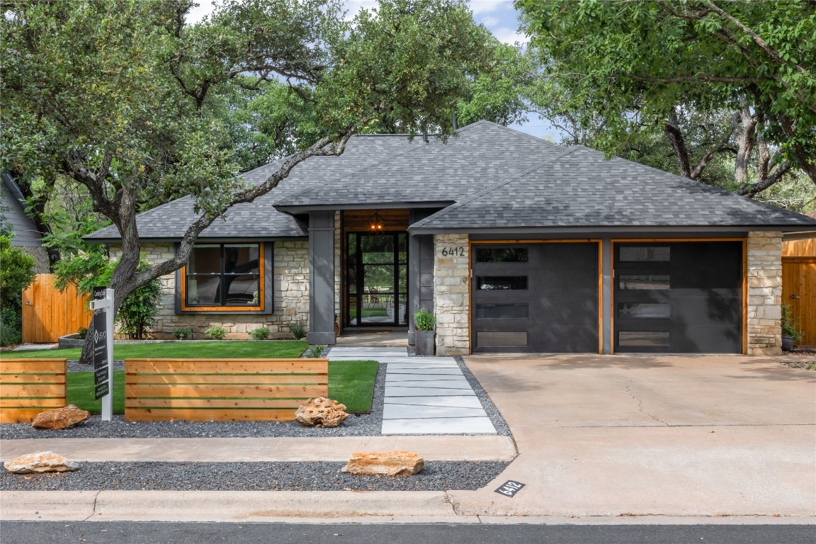 6412 Steer Trail Austin, TX 78749 - Photo 1 of 40 a front view of a house with a yard