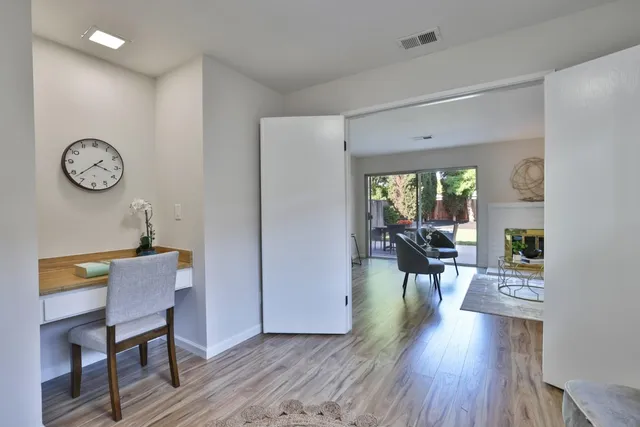 a view of a dining room with furniture window and wooden floor