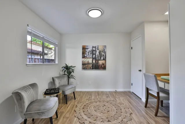 a living room with furniture and a rug