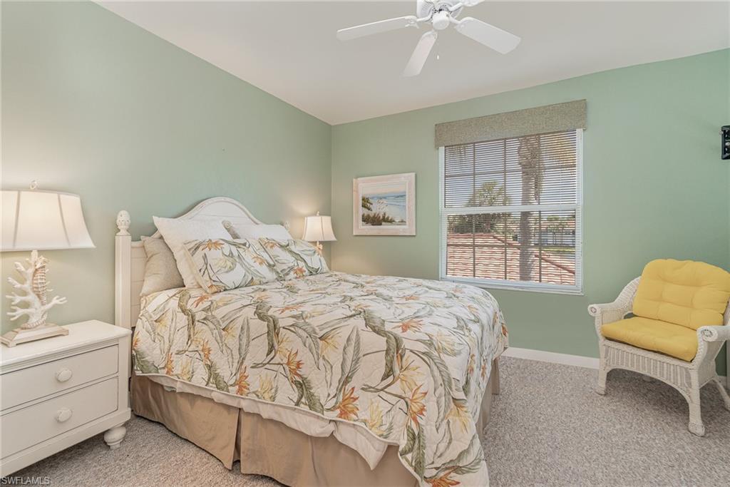 10921 Oak Island Road, Unit 203 Estero, FL 34135 - Photo 18 of 25 a bedroom with a bed and a window