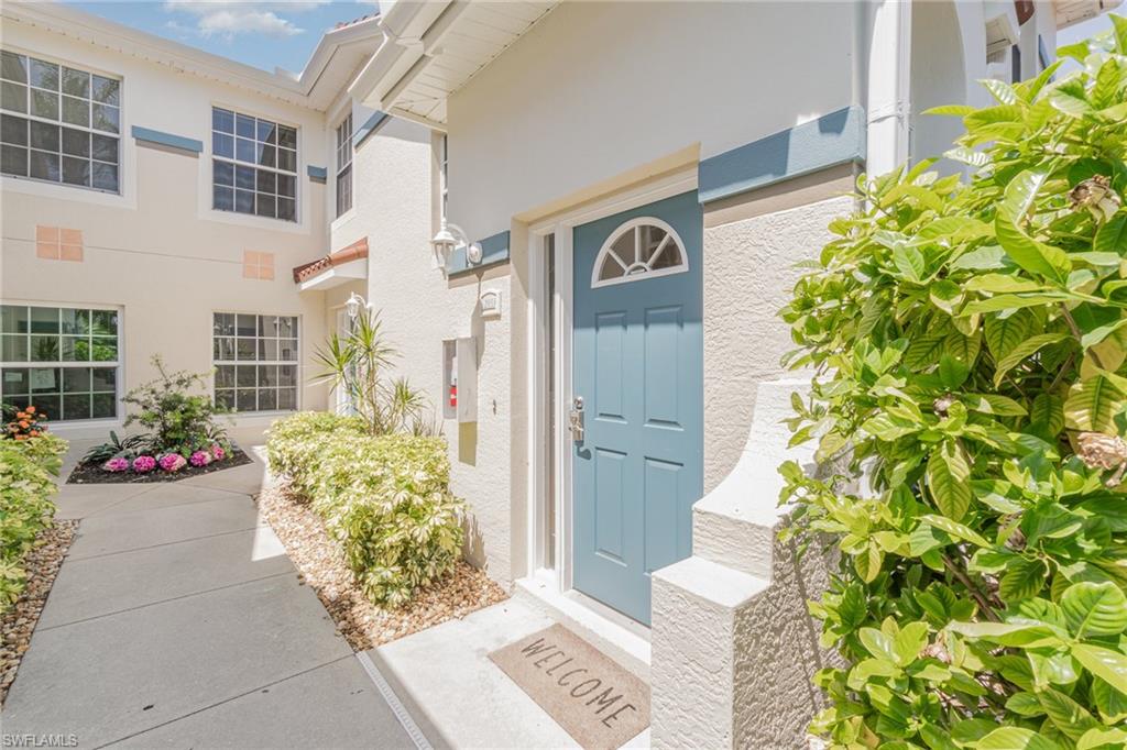 10921 Oak Island Road, Unit 203 Estero, FL 34135 - Photo 3 of 25 a front view of a house