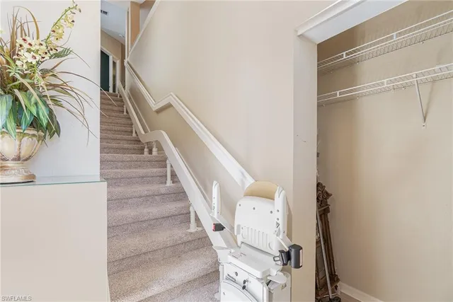 a view of entryway with wooden floor and stairs
