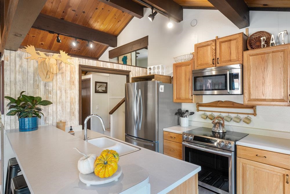 5659 Rhodesia Road Carnelian Bay, CA 96140 - Photo 11 of 28 a kitchen with a sink appliances and cabinets